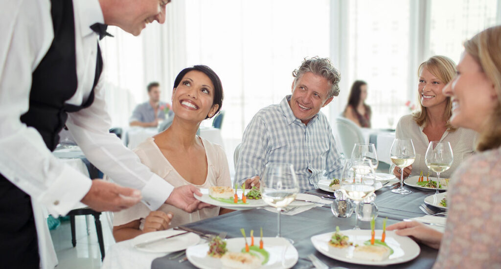 server handing food out to customers
