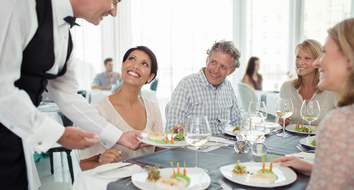 server handing food out to customers