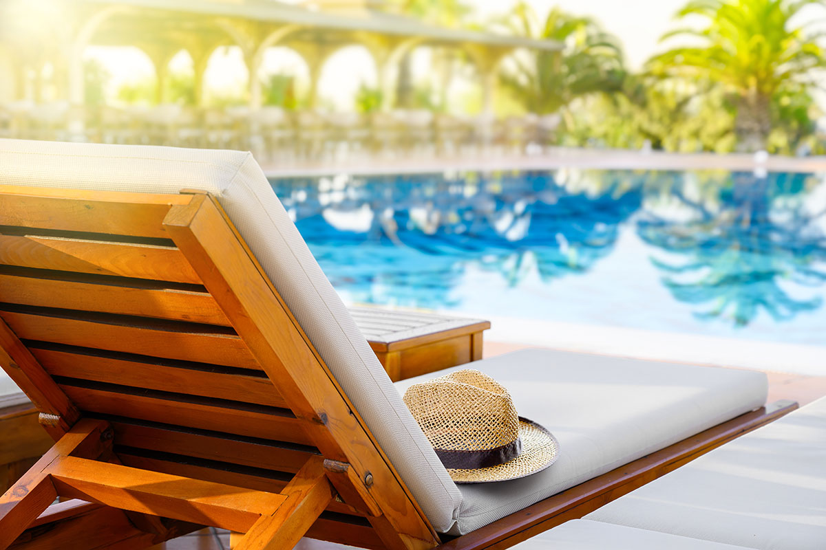 beach lounge chair on pool side resort luxury hotel